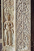 Angkor Wat temple, second enclosure, devatas sculpted in bas-relief with an extraordinary variety of intricate hair styles and costumes. 